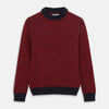 View 1 of product The Turnbull & Asser Red and Navy Wool Blend Billy Jumper features a red knit body with navy ribbed collar, cuffs, and hem, made from a wool and cotton blend, shown on a white background.