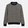 View 1 of product The Turnbull & Asser Navy and White Wool Blend Billy Jumper features a small checkered pattern with ribbed black collar, cuffs, and hem. Shown laid flat on a white background.