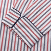 View 4 of product The Turnbull & Asser Red and Blue Stripe Cotton Quin Pyjamas feature a collared, long-sleeve button-up top with black piping and chest pocket, paired with matching striped pants for luxurious comfort and style.