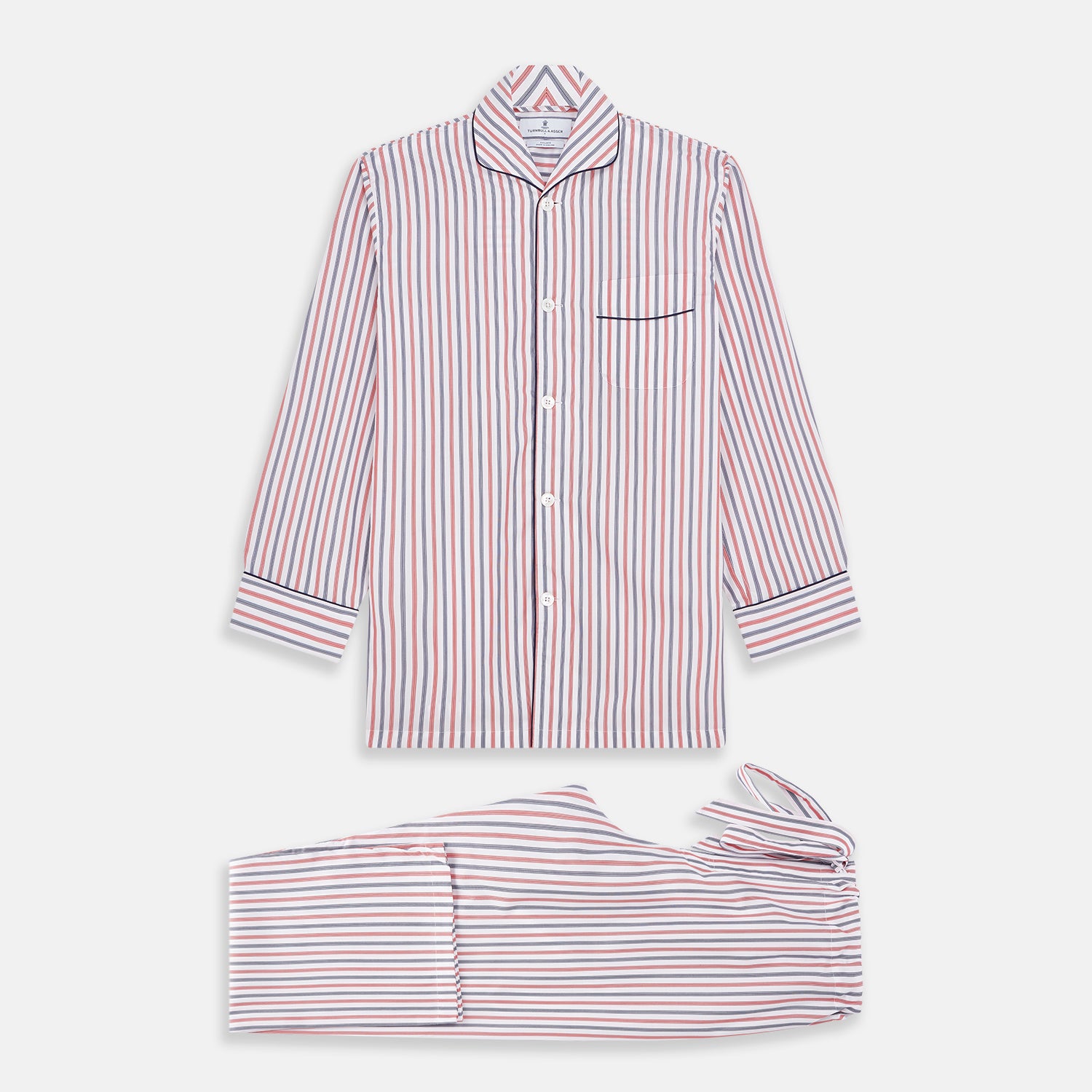 View 1 of product The Turnbull & Asser Red and Blue Stripe Cotton Quin Pyjamas feature a collared, long-sleeve button-up top with black piping and chest pocket, paired with matching striped pants for luxurious comfort and style.