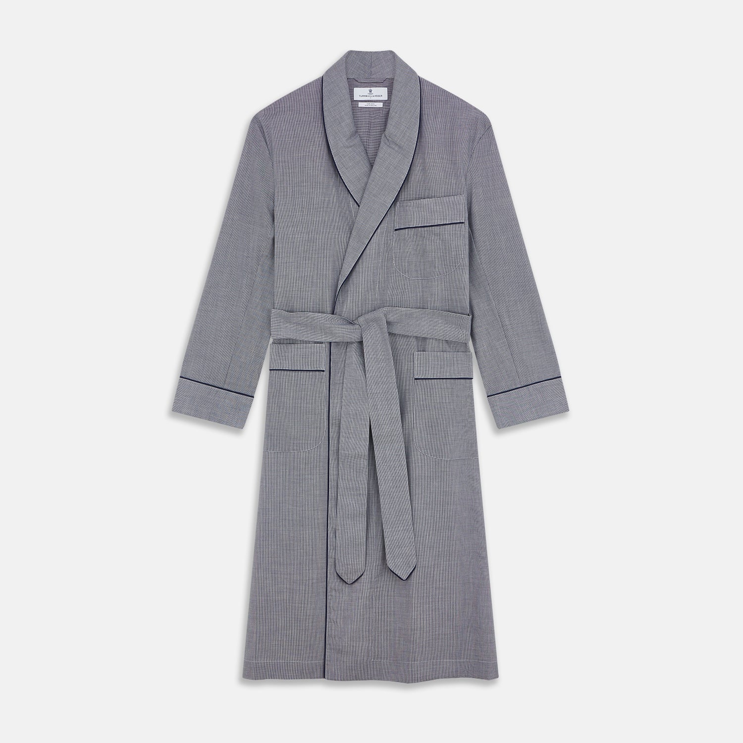 View 1 of product The Navy Houndstooth Wool Arnold Gown by Turnbull & Asser features a shawl collar, front chest pocket, long sleeves, and a matching fabric belt tied at the waist.