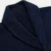 View 2 of product The Deep Navy Cashmere Baldwin Gown by Turnbull & Asser features a ribbed knit, long sleeves, shawl collar, two front pockets, and a waist tie—ideal as luxury loungewear or a chic navy dressing gown.
