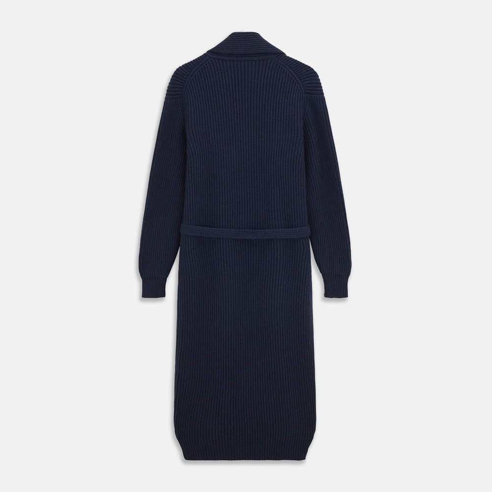 The Deep Navy Cashmere Baldwin Gown by Turnbull & Asser features a ribbed knit, long sleeves, shawl collar, two front pockets, and a waist tie—ideal as luxury loungewear or a chic navy dressing gown.