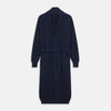 View 1 of product The Deep Navy Cashmere Baldwin Gown by Turnbull & Asser features a ribbed knit, long sleeves, shawl collar, two front pockets, and a waist tie—ideal as luxury loungewear or a chic navy dressing gown.