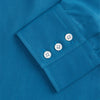 View 4 of product The Turnbull & Asser Blue Silk Regular Fit Mayfair Shirt features long sleeves, a pointed collar, and white buttons in a solid bright blue; displayed flat on a white background.
