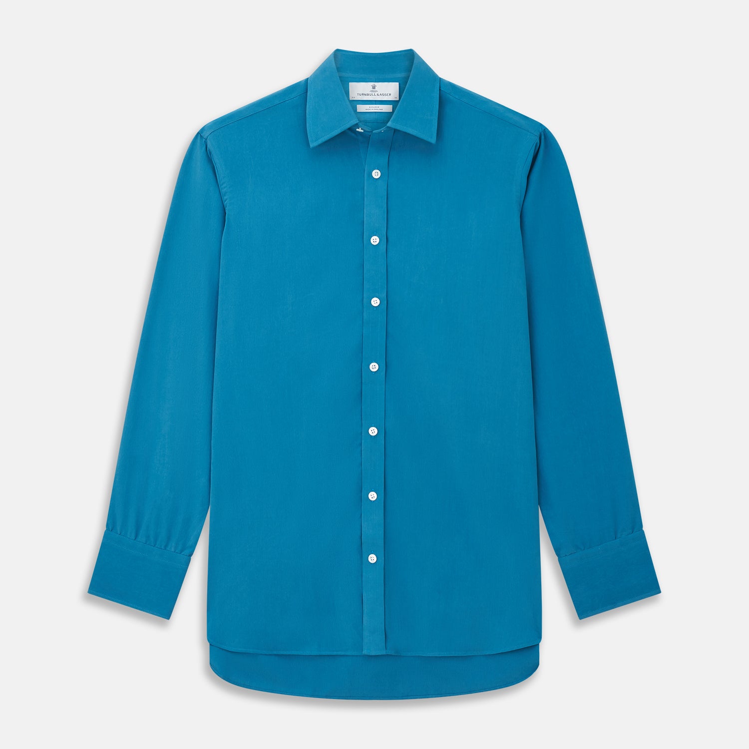 View 1 of product The Turnbull & Asser Blue Silk Regular Fit Mayfair Shirt features long sleeves, a pointed collar, and white buttons in a solid bright blue; displayed flat on a white background.