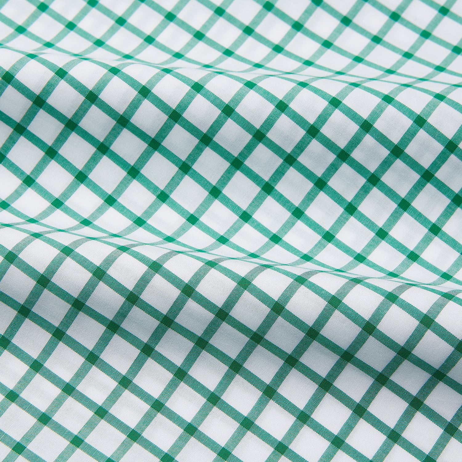 View 4 of product The Turnbull & Asser Green Check Cotton Regular Fit Mayfair Shirt features a green and blue check pattern on white, shown laid flat against a plain white background—a classic, versatile pick for any men’s wardrobe.