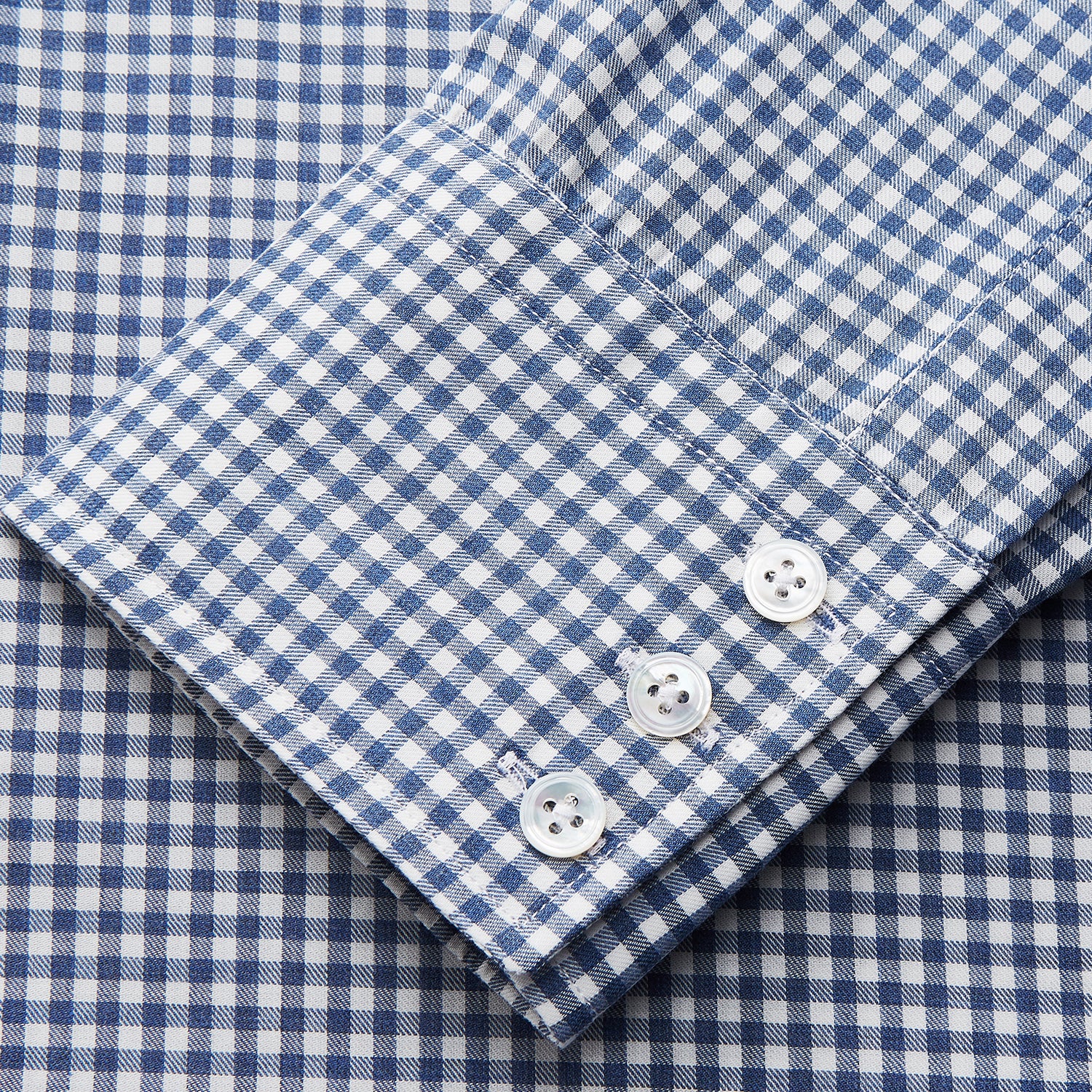 View 4 of product The Turnbull & Asser Blue Gingham Check Cotton Melange Regular Fit Mayfair Shirt features long sleeves, a classic T&A collar, neatly finished cuffs, and a stylish blue gingham check pattern.