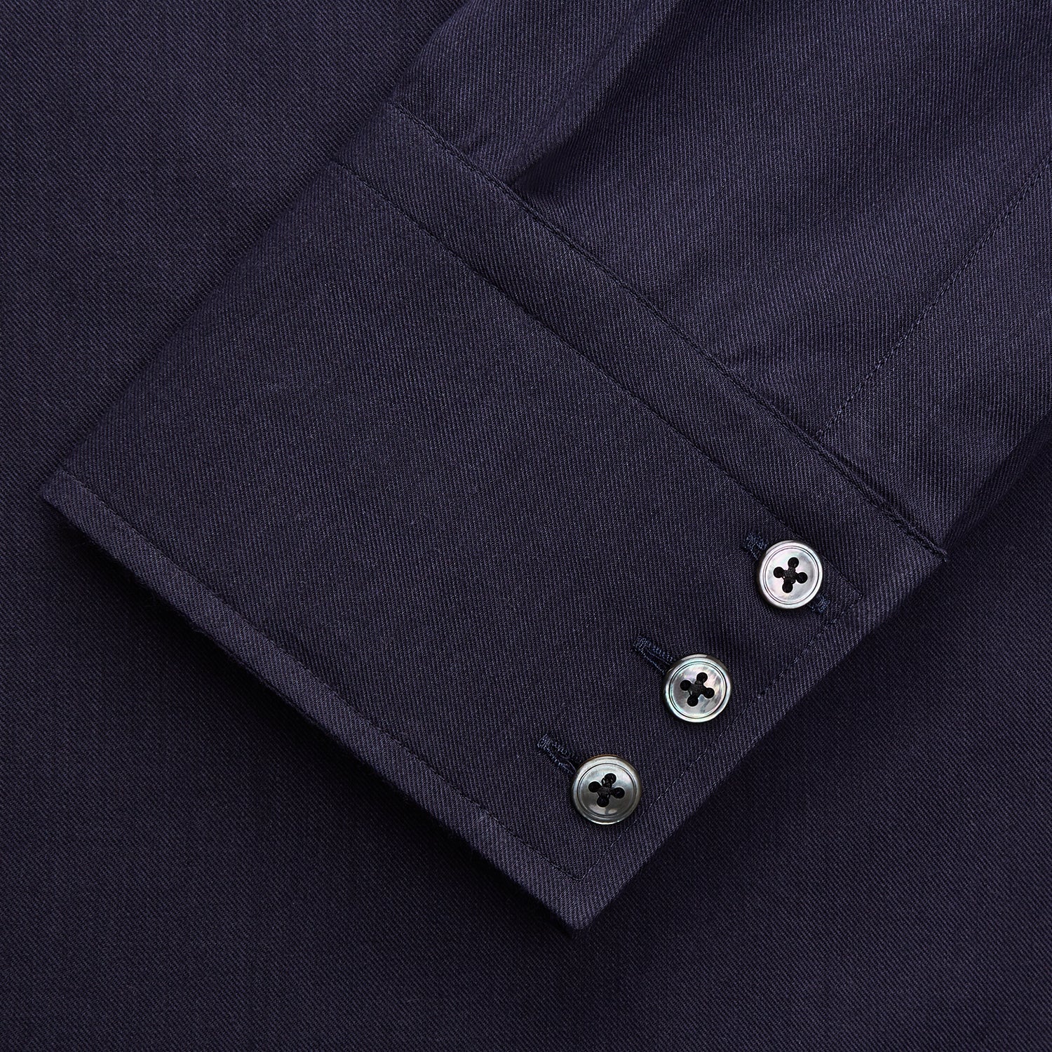 View 2 of product The Turnbull & Asser Navy Cotton and Wool Blend Regular Fit Mayfair Shirt features long sleeves, white buttons, a classic collar, and cuffed sleeves—a refined addition to the Mayfair collection.
