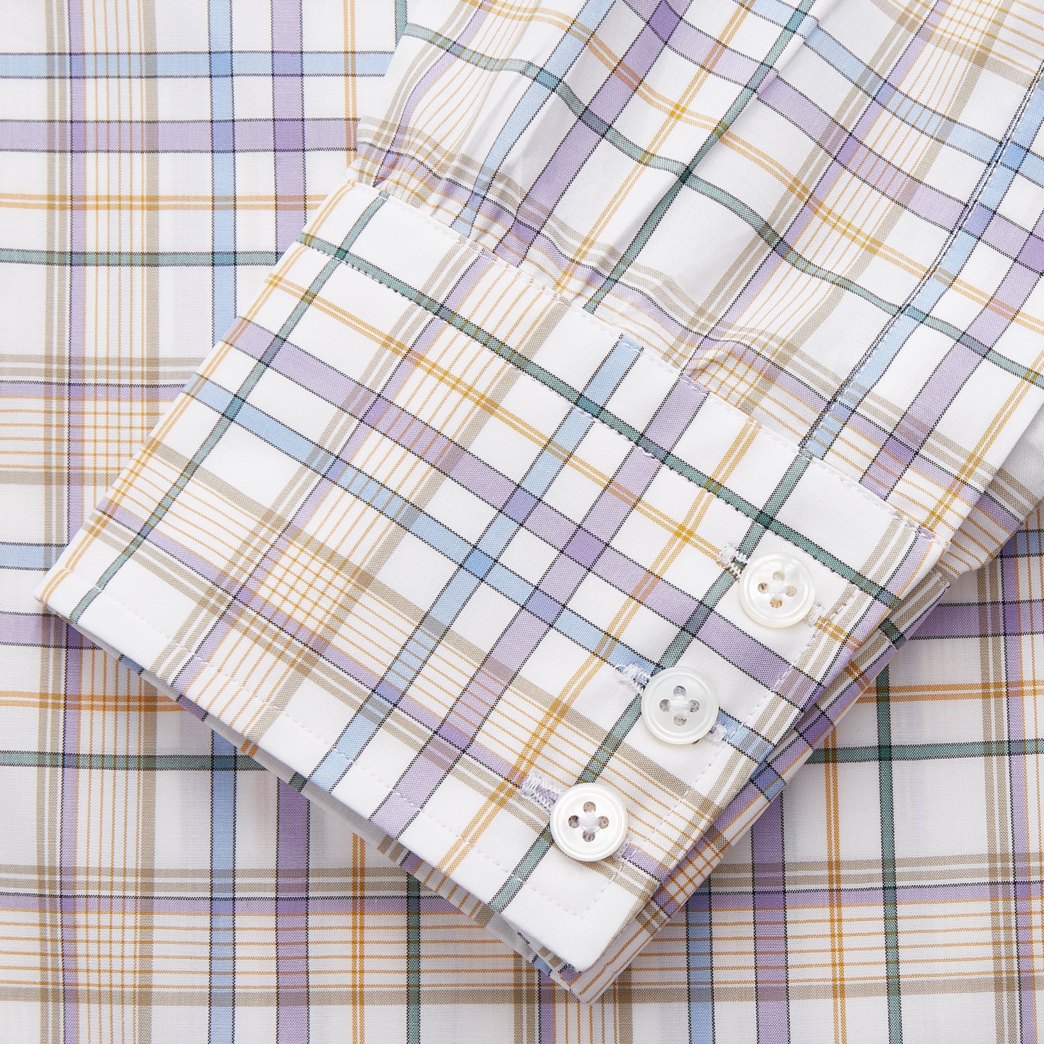 View 4 of product The Turnbull & Asser Colourful Garden Multi Check Cotton Regular Fit Mayfair Shirt, featuring a collar and buttoned cuffs, is laid flat on a white surface.