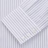 View 2 of product The Turnbull & Asser White and Blue Halo Stripe Cotton Regular Fit Mayfair Shirt features thin vertical stripes, a classic collar, and cuffed long sleeves—an essential men's formal shirt shown laid flat on a white background.