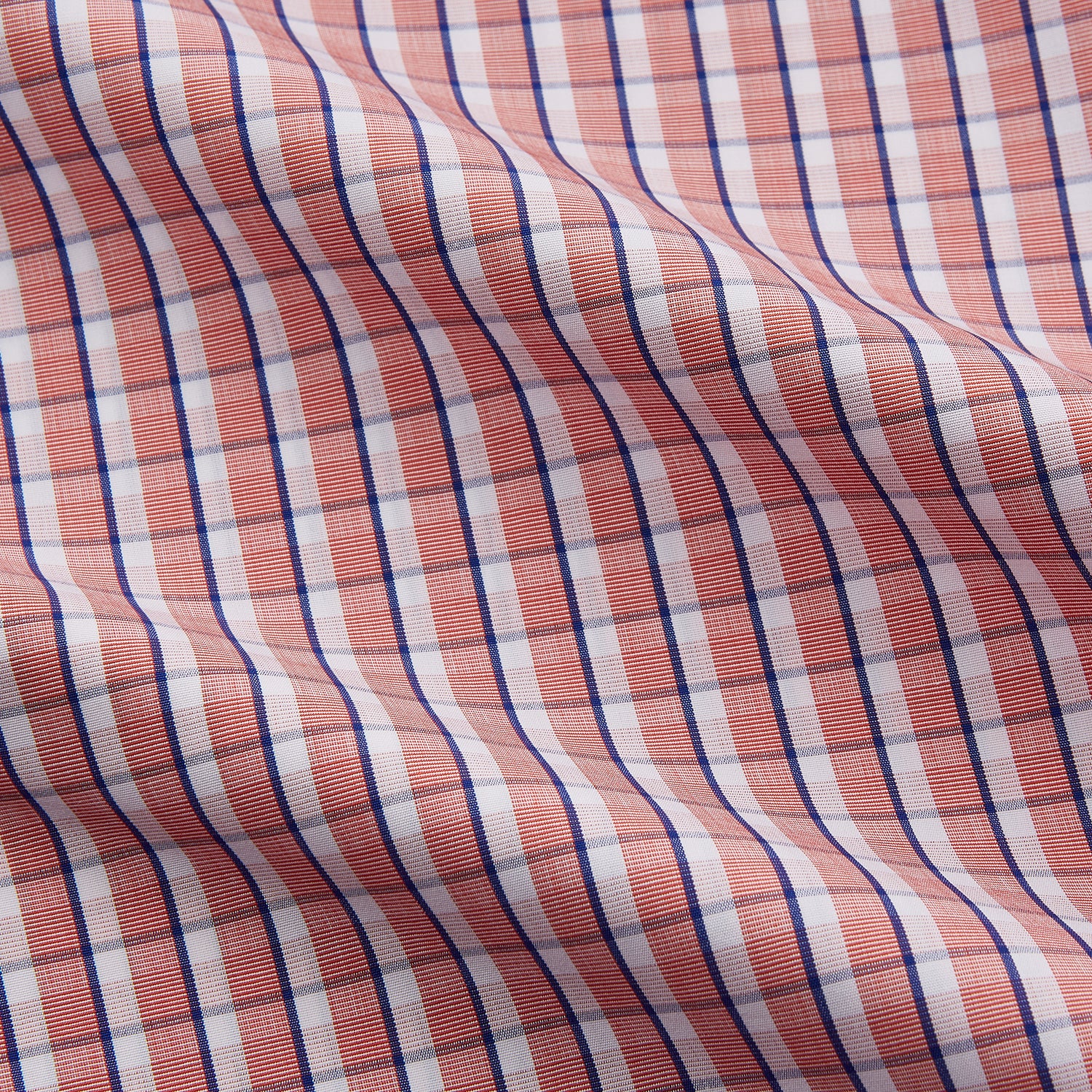 View 4 of product The Turnbull & Asser Orange and White Check Cotton Regular Fit Mayfair Shirt features a classic Mayfair collar and white buttons, shown laid flat on a white background.