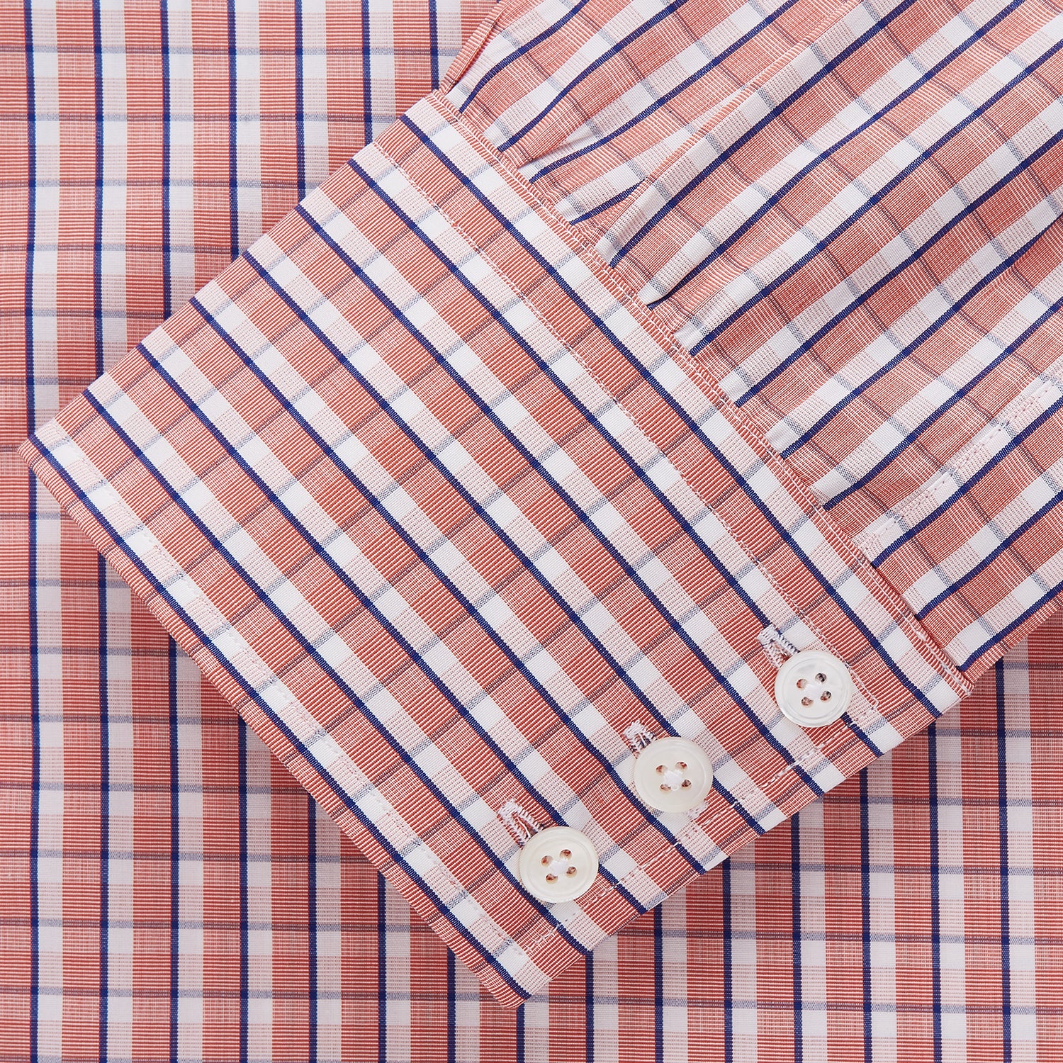 View 2 of product The Turnbull & Asser Orange and White Check Cotton Regular Fit Mayfair Shirt features a classic Mayfair collar and white buttons, shown laid flat on a white background.