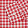 View 3 of product The Turnbull & Asser Burgundy Multi Check Cotton Weekend Fit Hayne Shirt is a long-sleeve style with a Dorset collar and red-and-white gingham checks, shown laid flat on a white background.