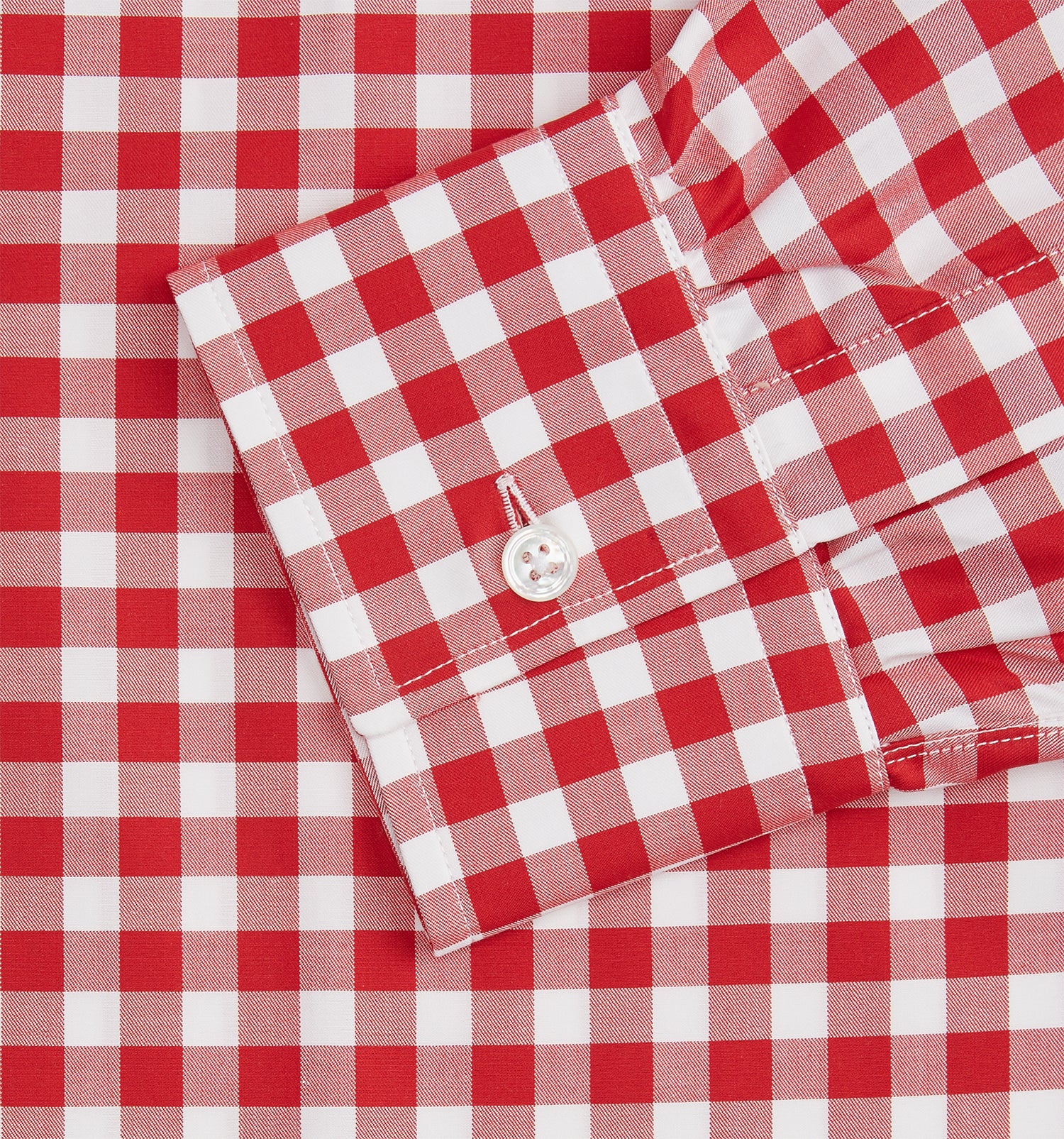 View 3 of product The Turnbull & Asser Burgundy Multi Check Cotton Weekend Fit Hayne Shirt is a long-sleeve style with a Dorset collar and red-and-white gingham checks, shown laid flat on a white background.