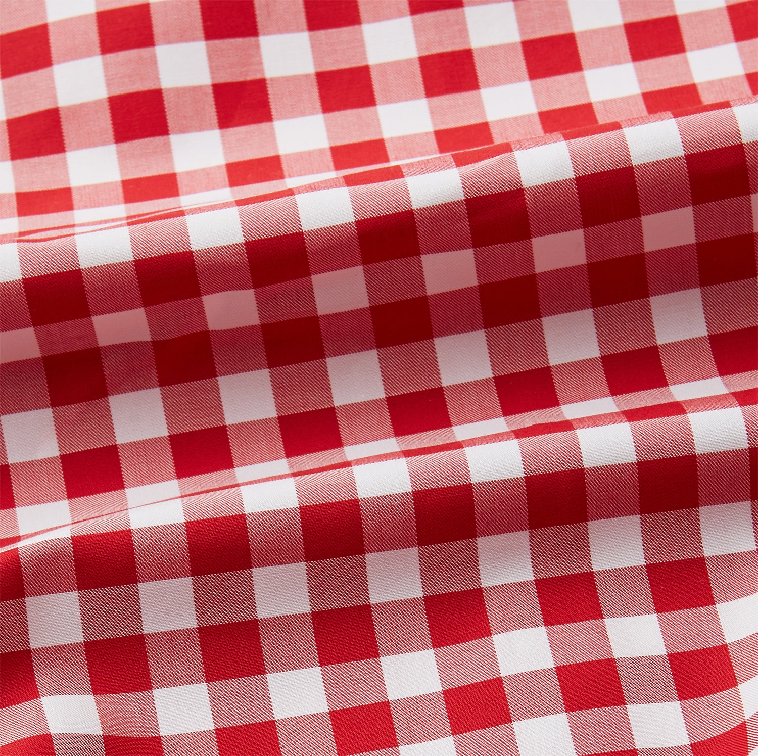 View 4 of product The Turnbull & Asser Burgundy Multi Check Cotton Weekend Fit Hayne Shirt is a long-sleeve style with a Dorset collar and red-and-white gingham checks, shown laid flat on a white background.