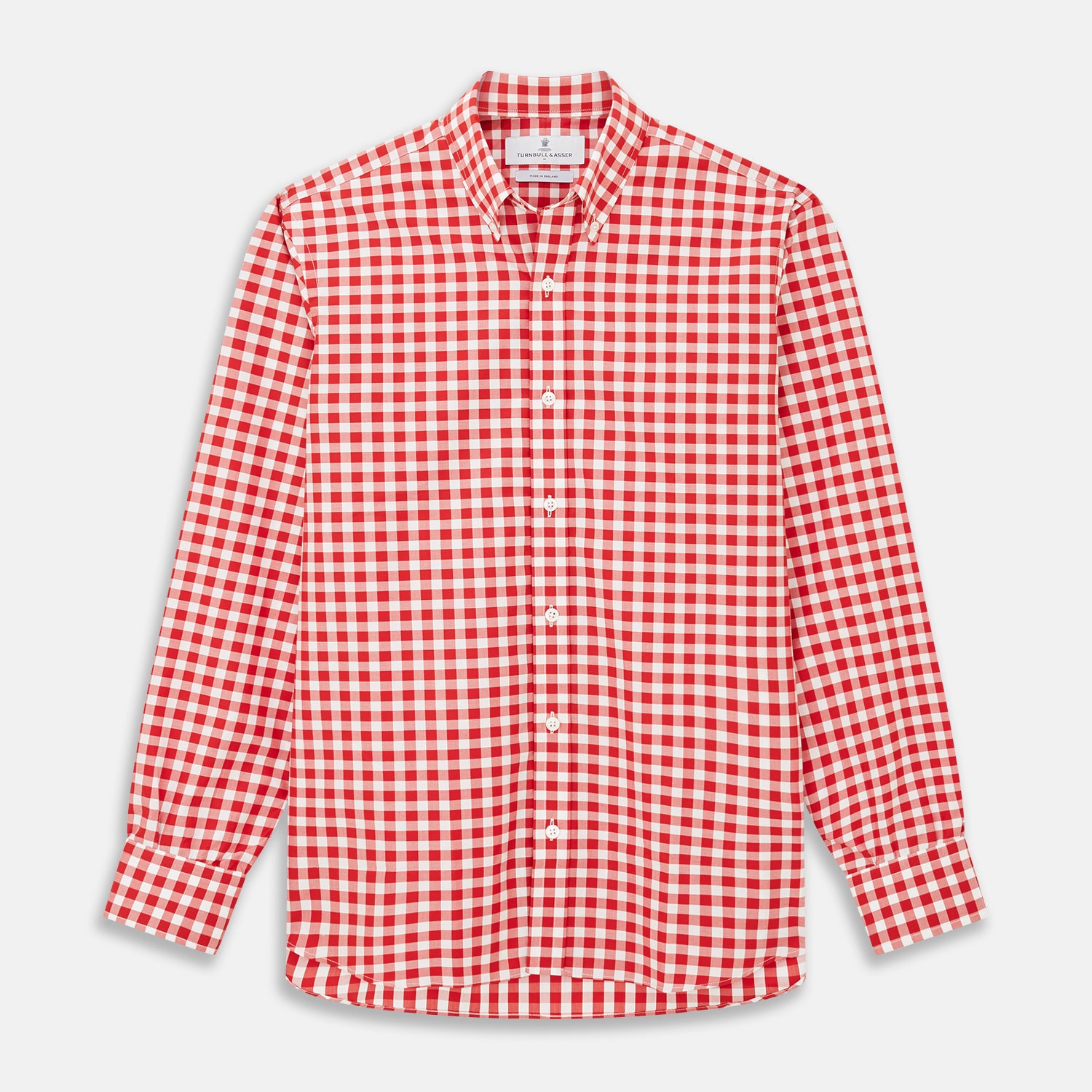 View 1 of product The Turnbull & Asser Burgundy Multi Check Cotton Weekend Fit Hayne Shirt is a long-sleeve style with a Dorset collar and red-and-white gingham checks, shown laid flat on a white background.
