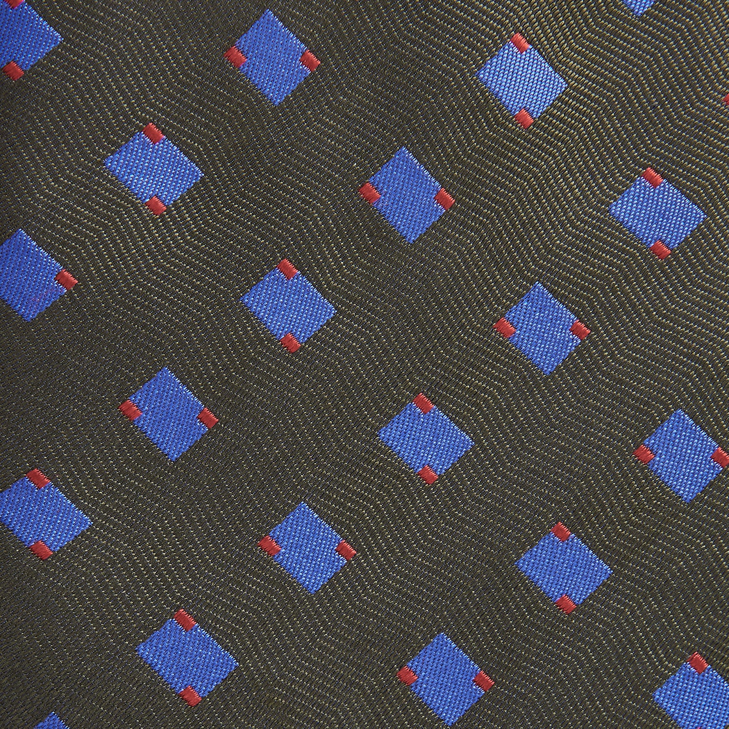 View 2 of product The Turnbull & Asser Dark Green and Blue Tile Silk Tie showcases a classic tile pattern with blue and red squares on herringbone fabric.