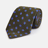 View 1 of product The Turnbull & Asser Dark Green and Blue Tile Silk Tie showcases a classic tile pattern with blue and red squares on herringbone fabric.