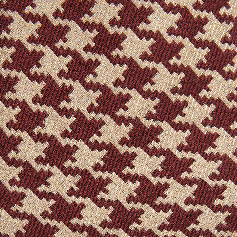 The Red and Peach Houndstooth Wool Blend Tie by Turnbull & Asser features a classic houndstooth pattern in red and peach, expertly crafted for timeless style.