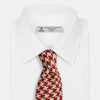 View 4 of product The Red and Peach Houndstooth Wool Blend Tie by Turnbull & Asser features a classic houndstooth pattern in red and peach, expertly crafted for timeless style.