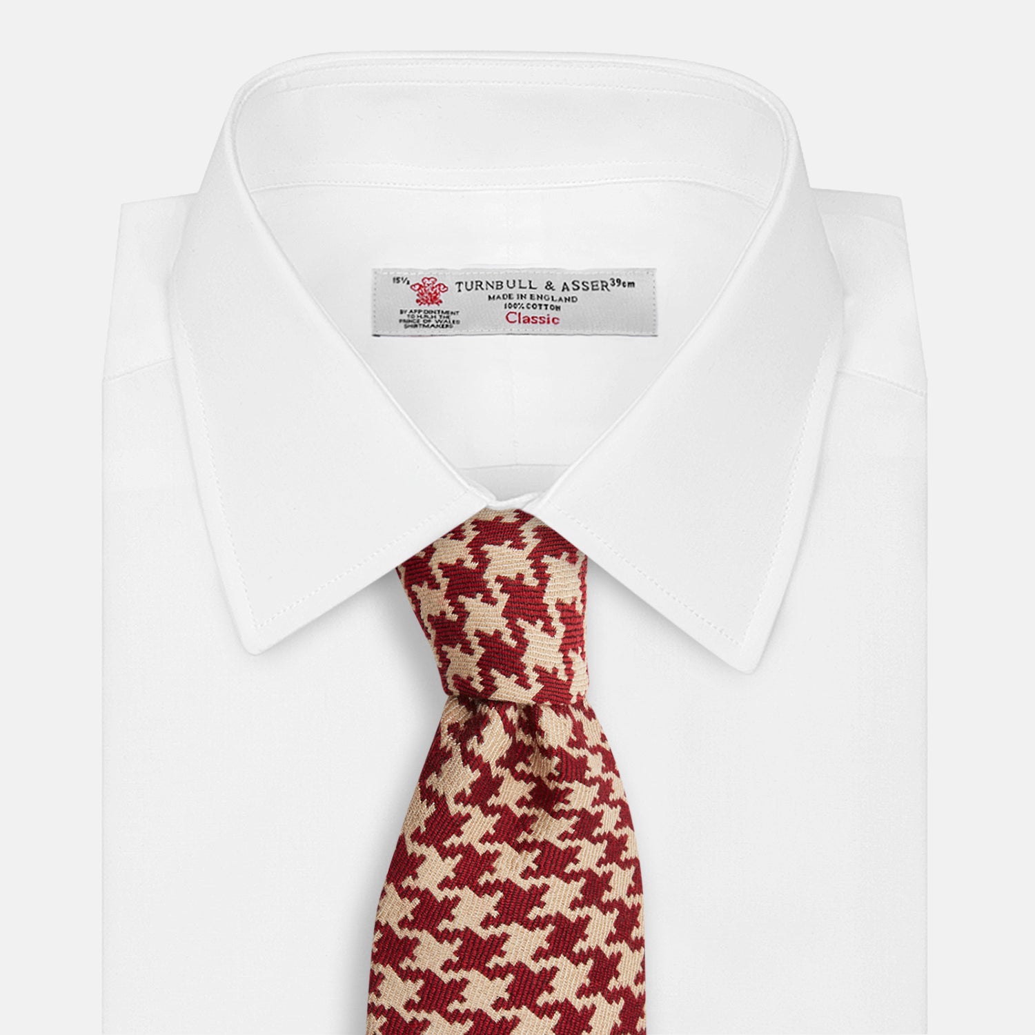 View 4 of product The Red and Peach Houndstooth Wool Blend Tie by Turnbull & Asser features a classic houndstooth pattern in red and peach, expertly crafted for timeless style.