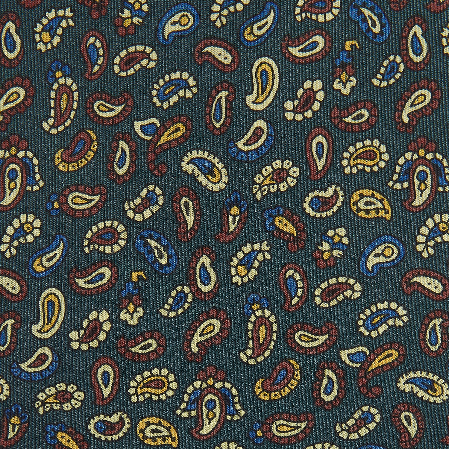View 2 of product The Marine Blue Paisley Silk Tie by Turnbull & Asser features a vibrant paisley pattern on a rich marine blue silk background—an elegant accessory for any occasion.