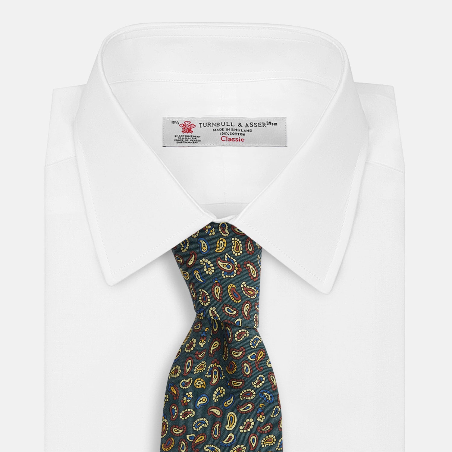 View 4 of product The Marine Blue Paisley Silk Tie by Turnbull & Asser features a vibrant paisley pattern on a rich marine blue silk background—an elegant accessory for any occasion.