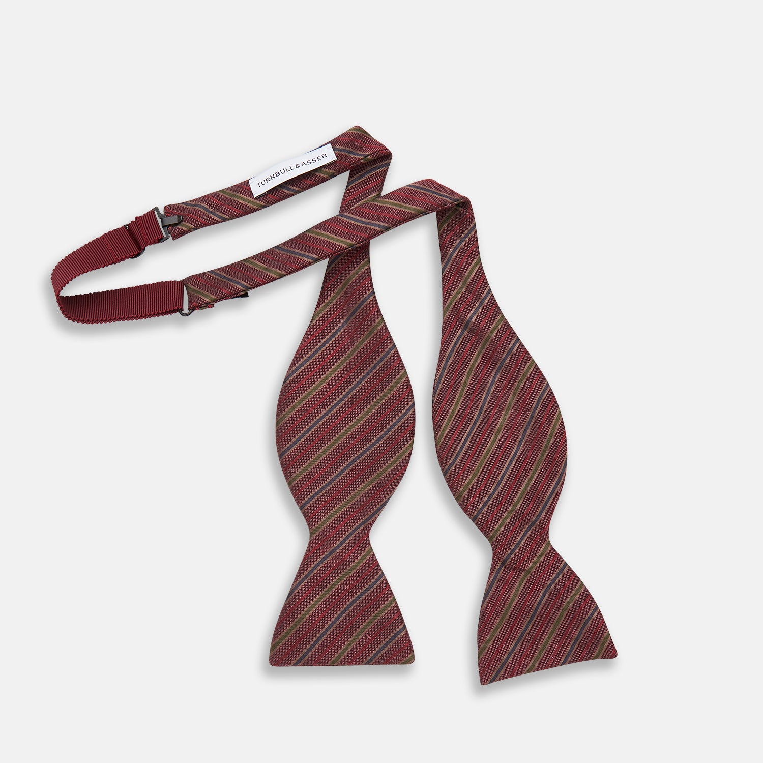 View 3 of product The Turnbull & Asser Claret and Green Multi Stripe Silk and Linen Bow Tie features diagonal stripes in red, beige, and green, shown on a plain white background.