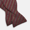 View 2 of product The Turnbull & Asser Claret and Green Multi Stripe Silk and Linen Bow Tie features diagonal stripes in red, beige, and green, shown on a plain white background.
