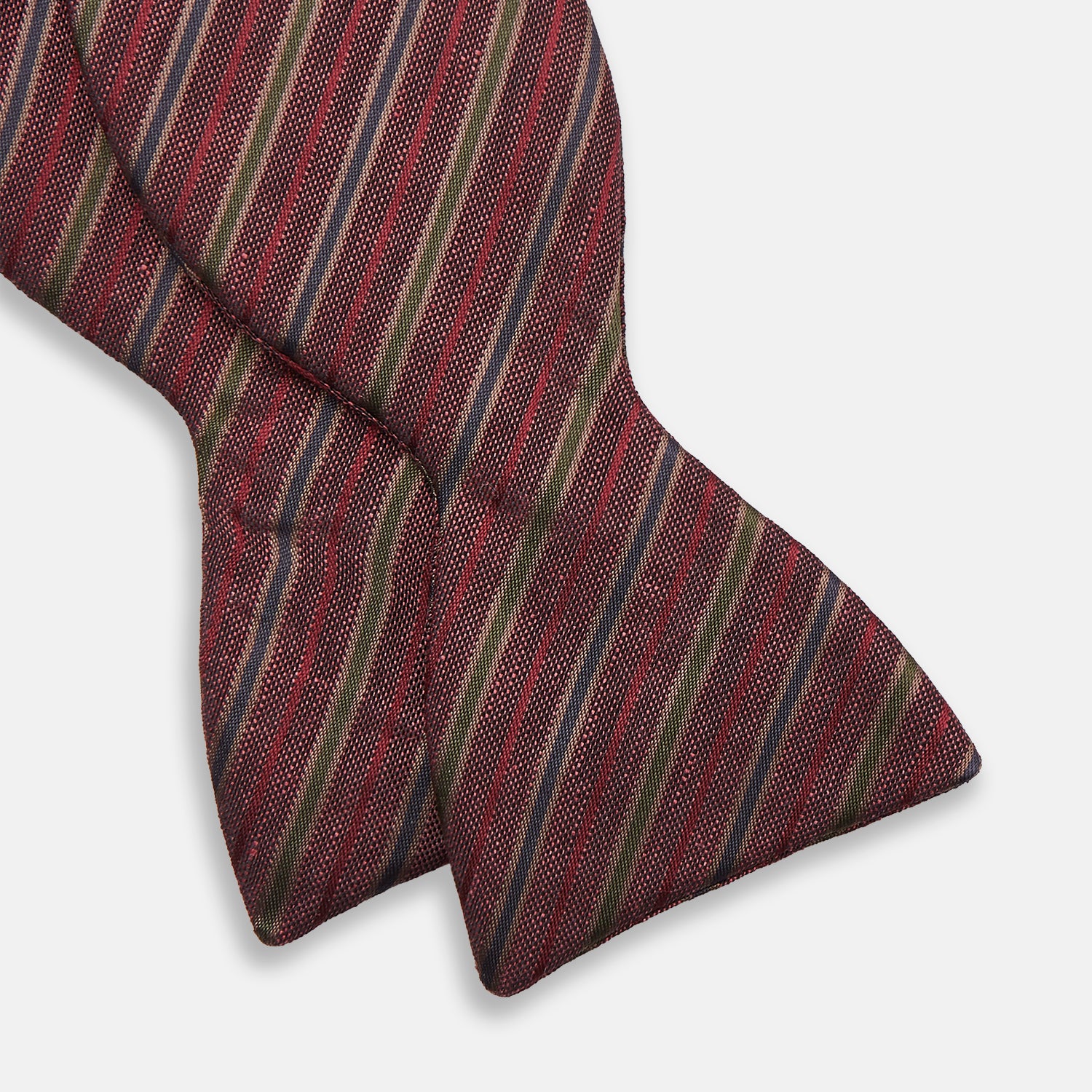 View 2 of product The Turnbull & Asser Claret and Green Multi Stripe Silk and Linen Bow Tie features diagonal stripes in red, beige, and green, shown on a plain white background.