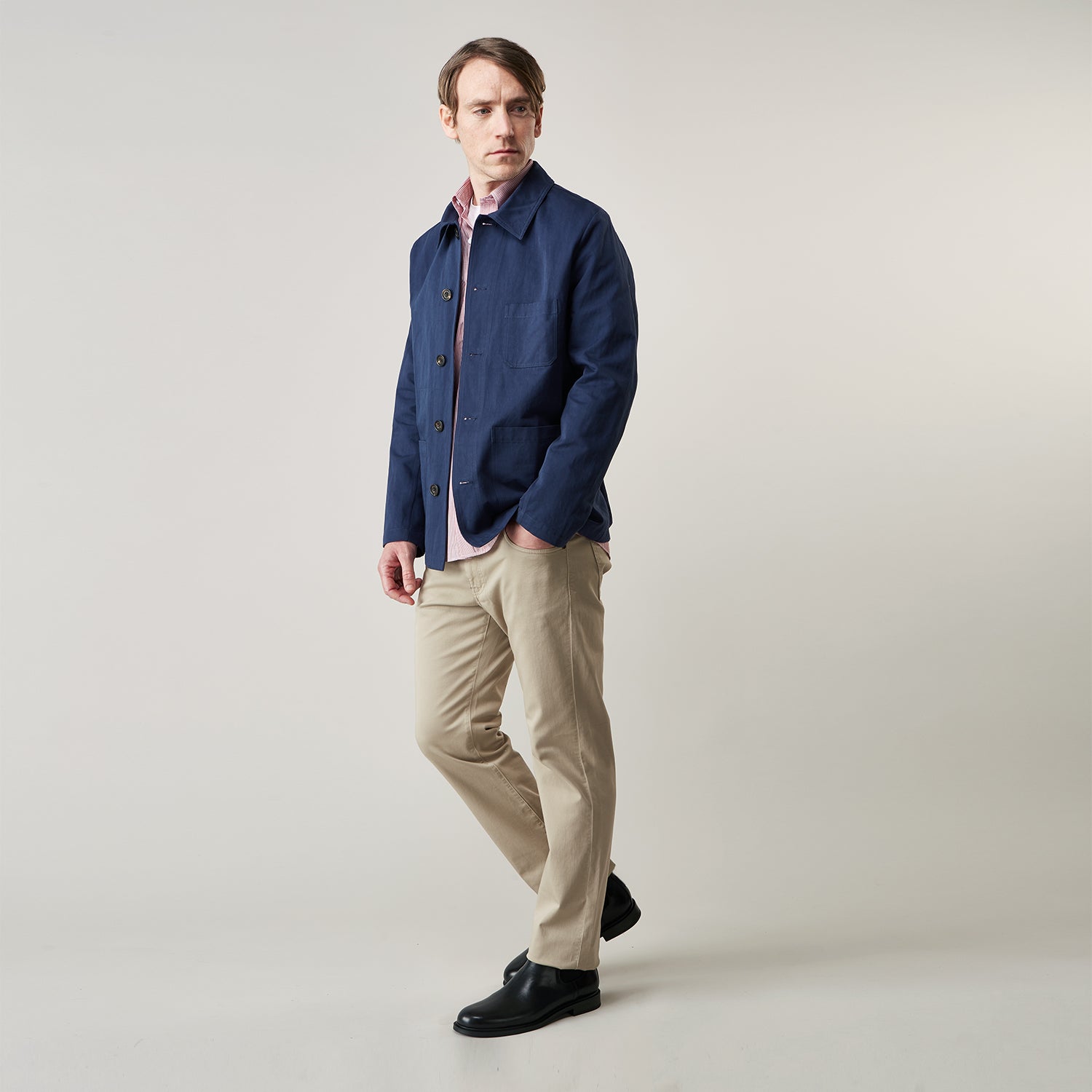 View 2 of product The Turnbull & Asser Khaki Stretch Cotton Five-Pocket Mylo Jeans are shown flat on a white background, highlighting their straight-leg fit, front and back pockets, belt loops, and button waist closure.