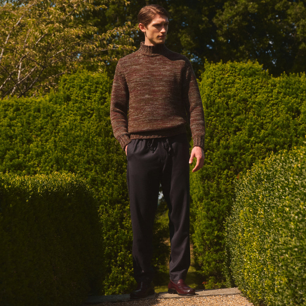 Turnbull & Asser Charcoal Tailored Drawstring Trousers in wool flannel, featuring an elastic waistband, straight legs, and side pockets, shown laid flat on a white background.