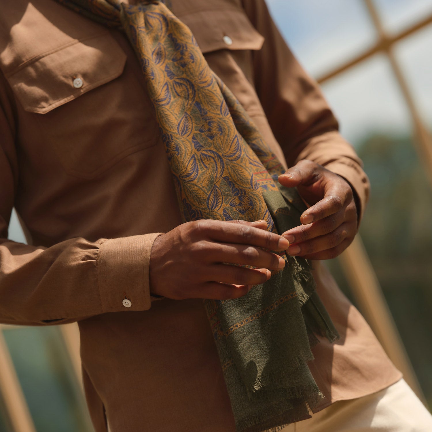 View 2 of product The Turnbull & Asser Brown Military Weekend Fit Cotton & Wool Shirt features a stand collar, 1-button cuffs, and two chest flap pockets; shown laid flat on a white background.