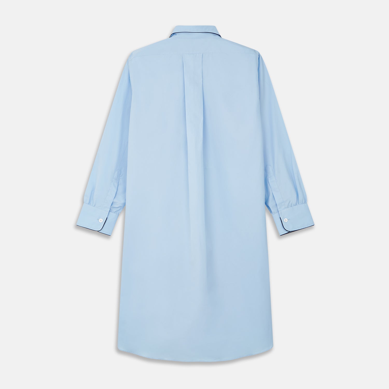 View 5 of product The Turnbull & Asser Light Blue Piped Cotton Nightshirt is a luxurious long-sleeve shirt dress with a pointed collar, black piping on the collar, cuffs, and chest pocket, button front closure, and curved hem.