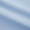 View 3 of product The Turnbull & Asser Light Blue Piped Cotton Nightshirt is a luxurious long-sleeve shirt dress with a pointed collar, black piping on the collar, cuffs, and chest pocket, button front closure, and curved hem.