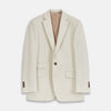 View 1 of product The Turnbull & Asser Stone Cotton Twill Jacket features a notch lapel, chest pocket, two front flap pockets, and brown buttons. Italian-tailored for smart-casual style, it is shown here against a white background.