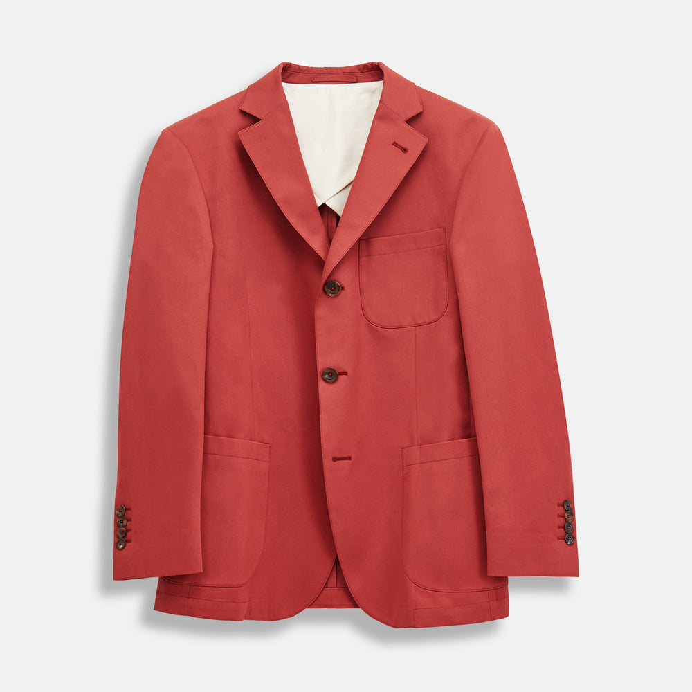 The Turnbull & Asser Clay Red Cotton 3 Button Blazer, tailored in Italy, features notched lapels, three front pockets, sleeve button details, and brown buttons, shown against a plain white background.