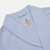 View 2 of product The Turnbull & Asser Blue & Pink Poplin Cotton Check Dressing Gown features a wide collar, pink trim, and a front sash—stylish and compact enough to pack for your next trip.