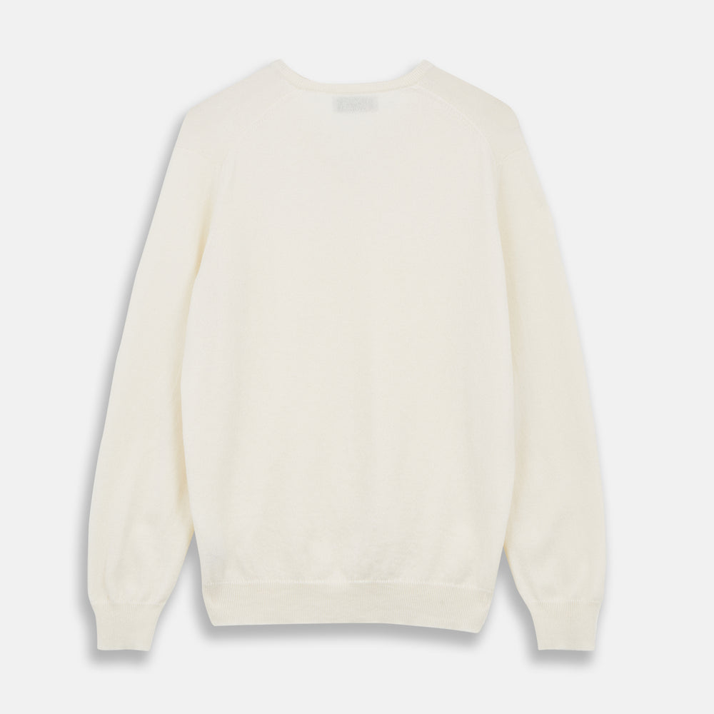 The Turnbull & Asser Cream Cashmere V-Neck Jumper is a luxury knitwear piece with ribbed cuffs and hem, shown laid flat on a white background. Its classic long-sleeve style offers timeless elegance.