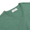 View 2 of product The Turnbull & Asser Green Cashmere V-Neck Jumper features long sleeves, ribbed cuffs and hem, and is styled in classic Scottish knitwear, shown flat against a white background.