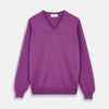 View 1 of product The Turnbull & Asser Magenta Cashmere V-Neck Jumper features long sleeves, ribbed cuffs, and a ribbed hem, shown against a plain white background.