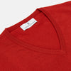 View 2 of product The Red Cashmere Slipover by Turnbull & Asser is a sleeveless, V-neck vest in pure cashmere, shown flat on a white background—an ideal lightweight layer for any season.