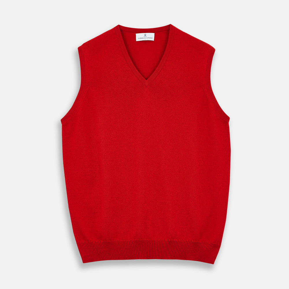 The Red Cashmere Slipover by Turnbull & Asser is a sleeveless, V-neck vest in pure cashmere, shown flat on a white background—an ideal lightweight layer for any season.