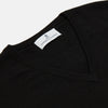 View 2 of product The Turnbull & Asser Black Cashmere Slipover, a sleeveless V-neck sweater vest made from pure cashmere, is shown flat against a white background.