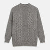 View 1 of product The Turnbull & Asser Merino Knitted Raglan Sleeve Crewneck Jumper in gray features intricate front and sleeve knit patterns, a high neckline, and long sleeves—an essential piece of men’s knitwear. Laid flat on a white background.