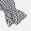 View 3 of product The Turnbull & Asser Black Houndstooth Silk Bow Tie features a classic black and white pattern, displayed against a plain white background—an elegant choice to elevate any formal ensemble.