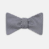 View 1 of product The Turnbull & Asser Black Houndstooth Silk Bow Tie features a classic black and white pattern, displayed against a plain white background—an elegant choice to elevate any formal ensemble.