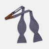 View 2 of product The Turnbull & Asser Brown and Blue Circle and Spot Silk Bow Tie features a blue silk base with light blue and brown circular dots on textured fabric, shown against a white background.