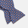 View 3 of product The Turnbull & Asser Brown and Blue Circle and Spot Silk Bow Tie features a blue silk base with light blue and brown circular dots on textured fabric, shown against a white background.